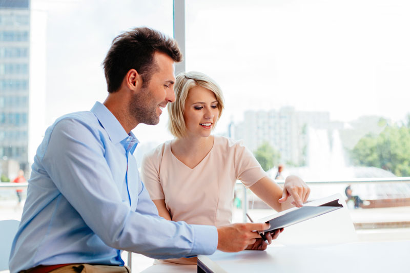 man and woman on laptop